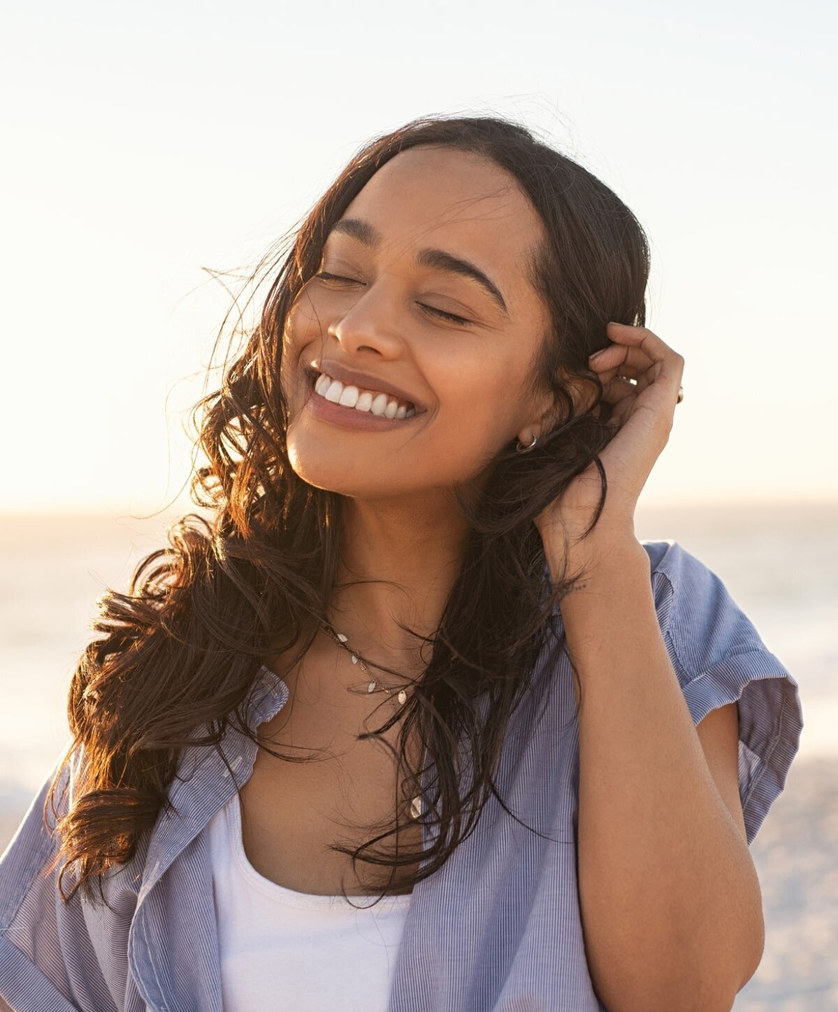 Jupiter Hydrafacial Model touching their hair